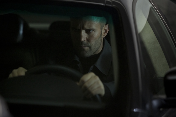 Jason Statham driving a car