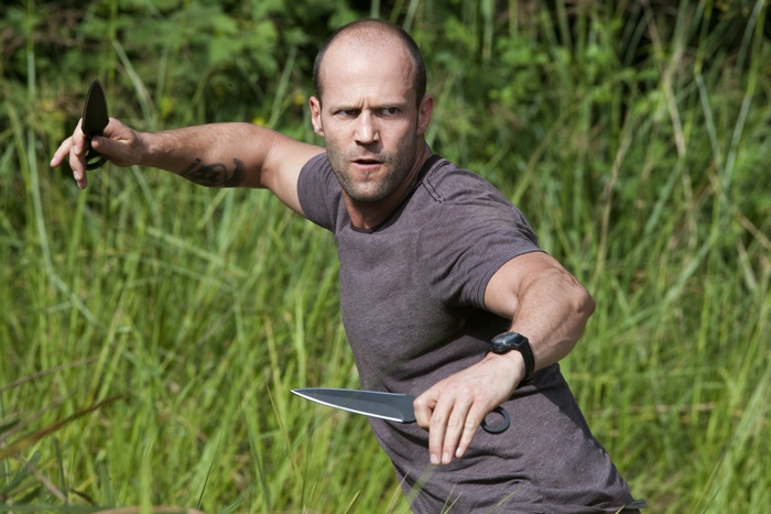 Jason Statham holding knives