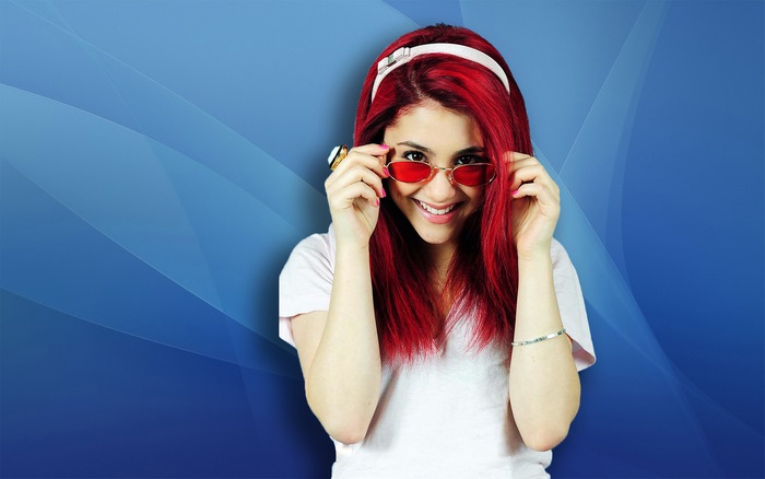 Ariana Grande with red hair and sunglasses