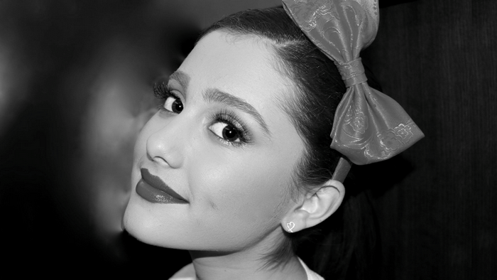 Ariana Grande with a red bow