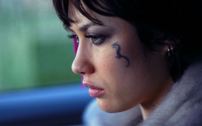 Olga Kurylenko with a dragon tattoo