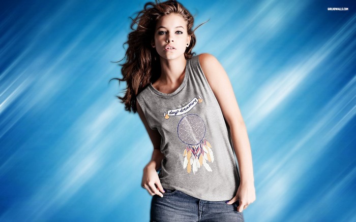 Barbara Palvin wearing a tank top and denim shorts