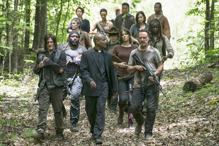 The Walking Dead group walking in forest