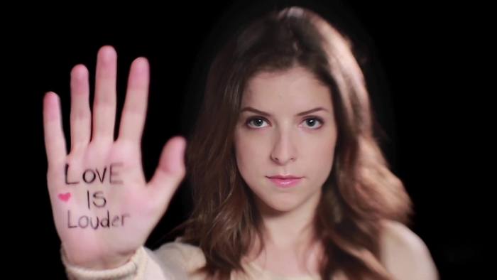Anna Kendrick with 'Love Is Louder' on her hand