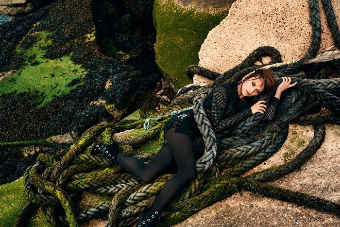 Alicia Vikander on ropes by the sea