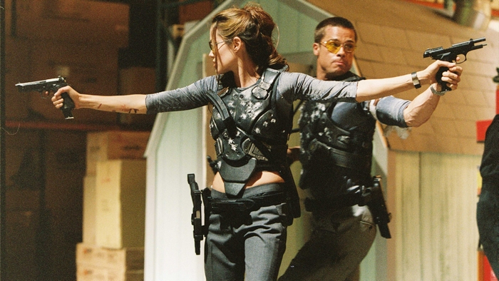 Brad Pitt and Angelina Jolie with guns