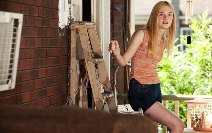 Elle Fanning on a porch