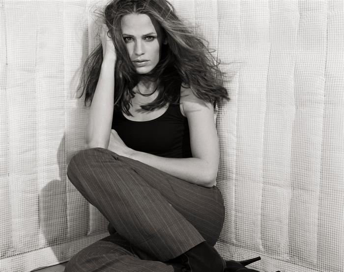 Jennifer Garner posing in black tank top and pinstripe pants