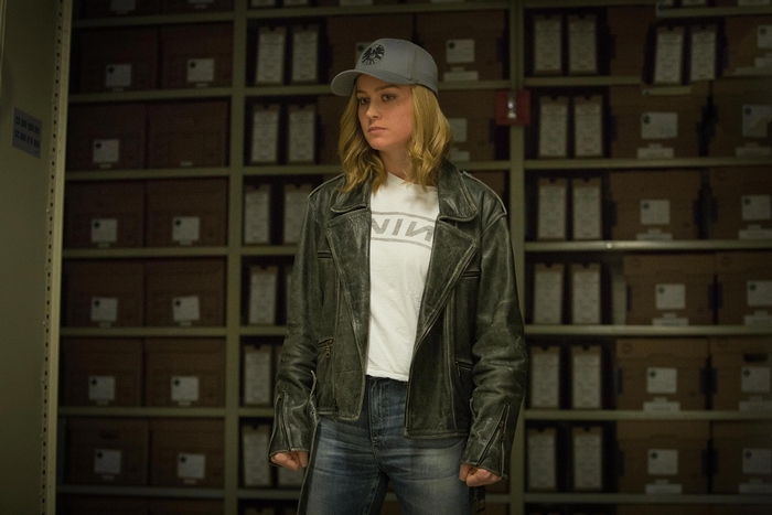Brie Larson as Captain Marvel in a storage room