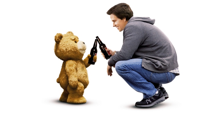 Ted and Mark Wahlberg toasting with beer bottles
