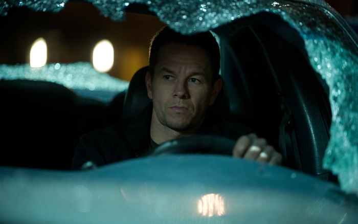 Mark Wahlberg driving a car at night