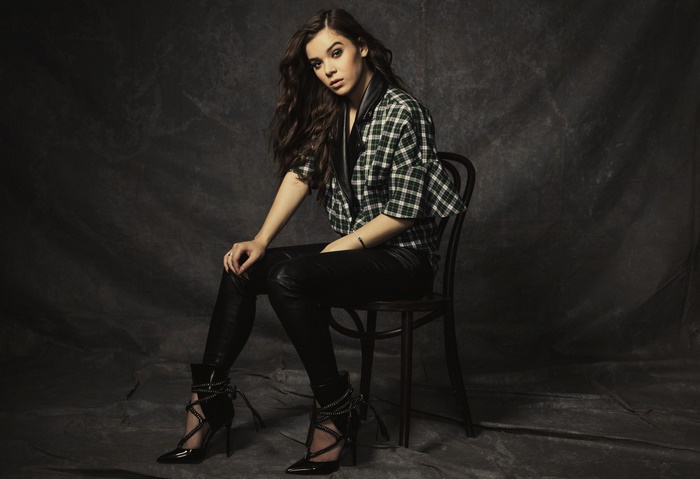 Hailee Steinfeld sitting on a chair