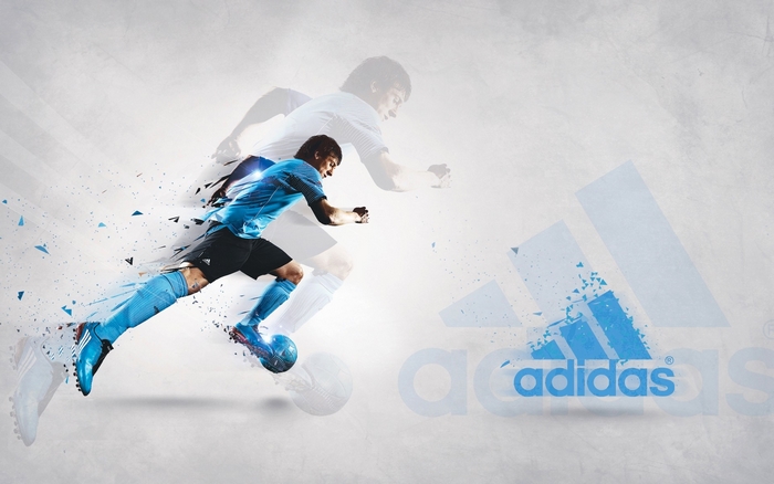 Lionel Messi playing soccer with Adidas logo