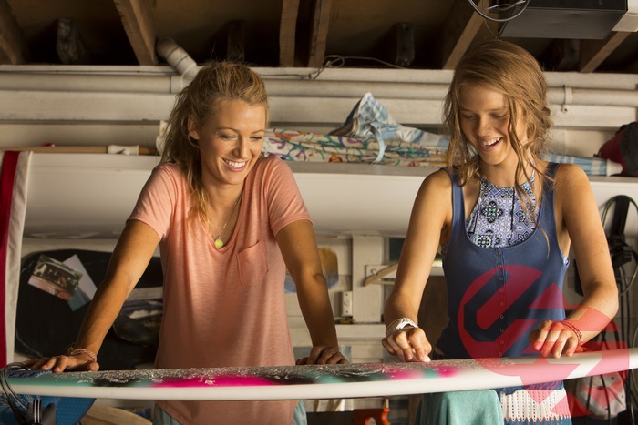 Blake Lively and another woman with a surfboard