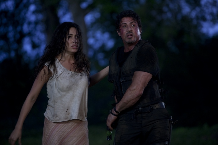 Sylvester Stallone and a woman in a forest