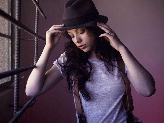 Michelle Trachtenberg wearing a hat and suspenders