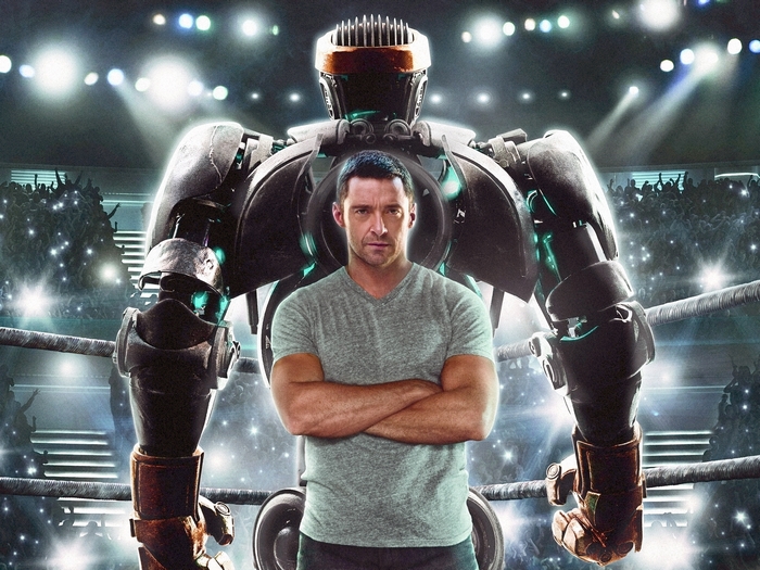 Hugh Jackman with a robot in a boxing ring