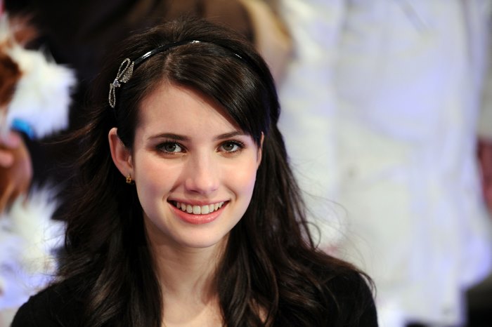 Smiling Emma Roberts with Dark Hair and Black Headband