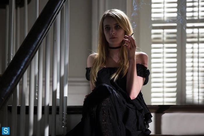 Emma Roberts smoking on stairs
