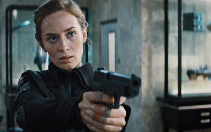 Emily Blunt holding a gun