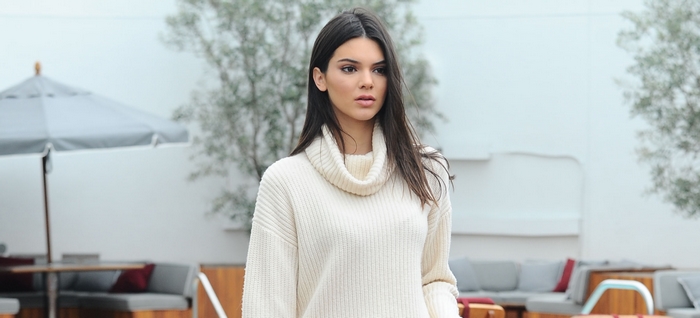Kendall Jenner wearing a cream turtleneck sweater