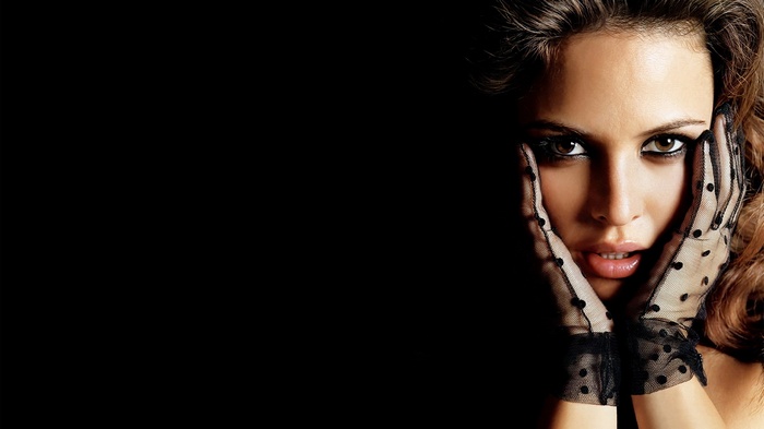 Woman with black polka dot gloves