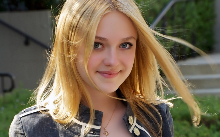Portrait of Smiling Dakota Fanning Outdoors