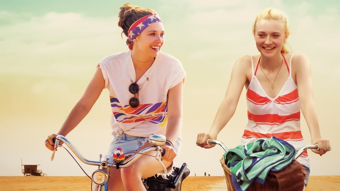 Dakota Fanning and Elizabeth Olsen on bicycles