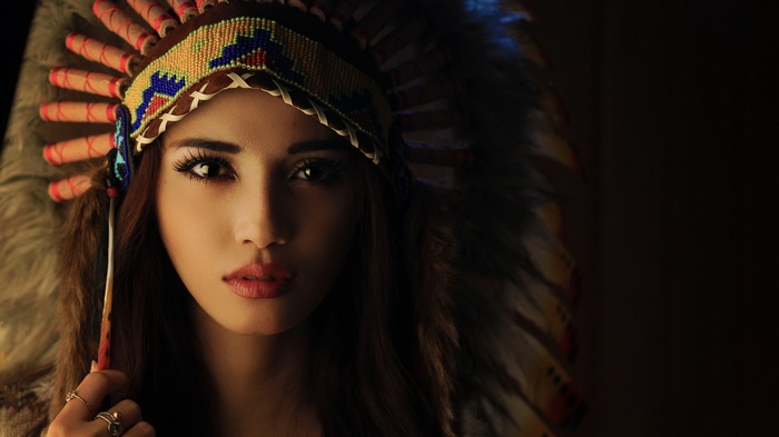 Woman wearing a Native American headdress