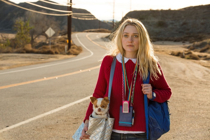 Dakota Fanning with a dog on a road