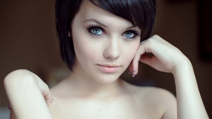 Woman with blue eyes and short black hair