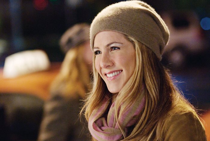 Jennifer Aniston wearing a beanie and scarf