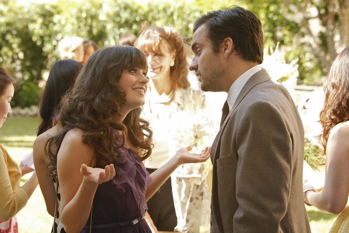 Jake Johnson and Zooey Deschanel at an outdoor event