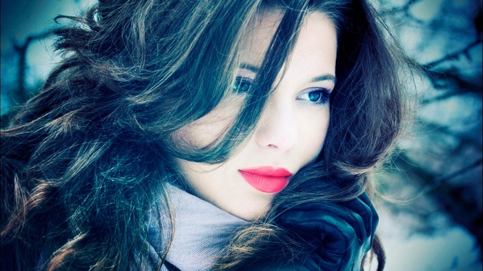 Woman with blue eyes and red lips