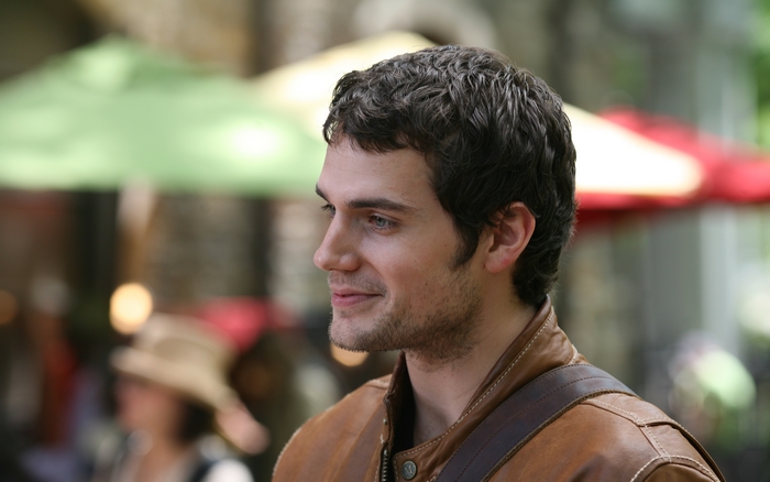 Henry Cavill in a brown leather jacket