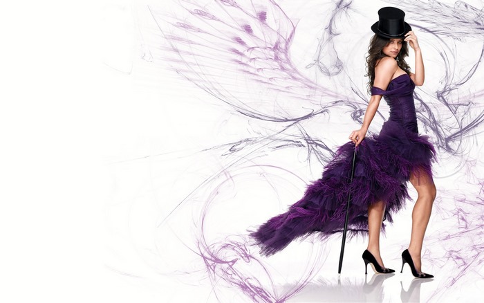 Evangeline Lilly in a purple dress and top hat