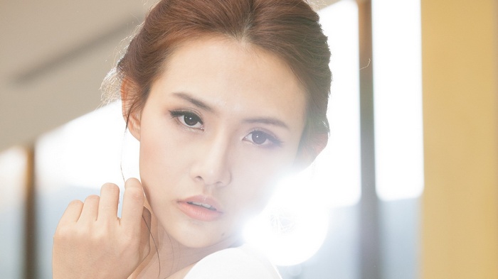 Woman with light flare on face