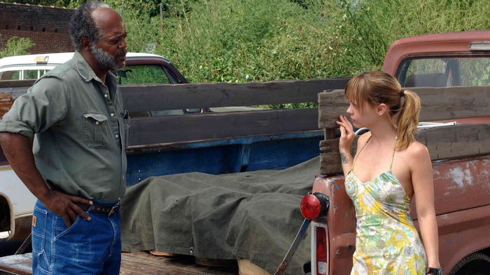Samuel L. Jackson and a woman by a truck