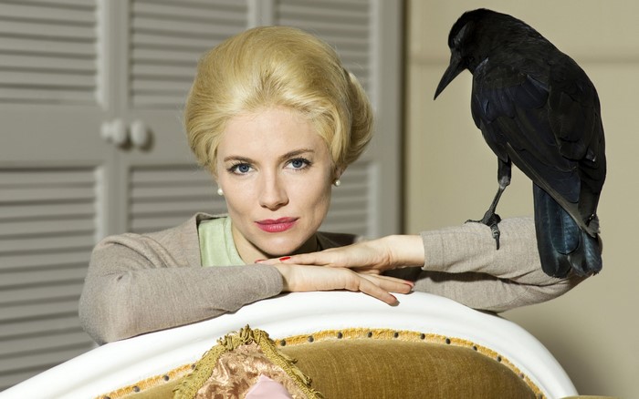 Sienna Miller with a crow
