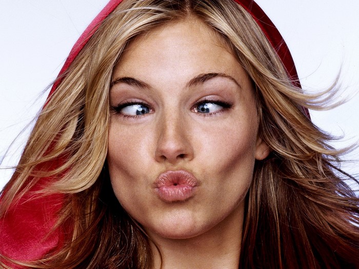 Sienna Miller wearing a red hood