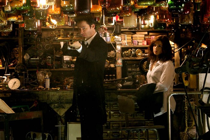 Keanu Reeves in a cluttered room