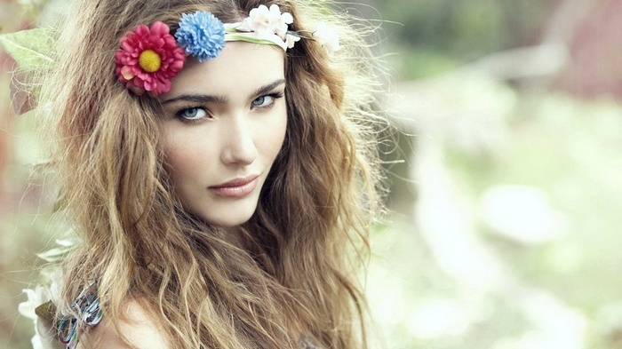 Woman with flower crown and wavy hair