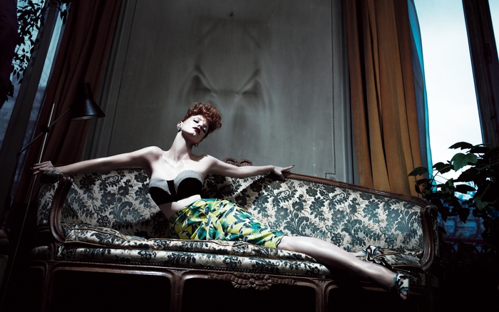 Jessica Chastain on a vintage sofa
