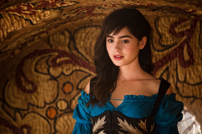 Lily Collins in a blue and black costume