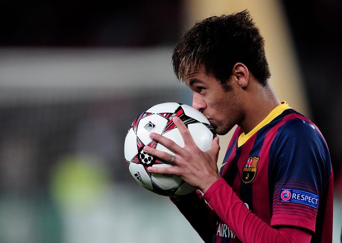 Neymar Jr kissing a soccer ball