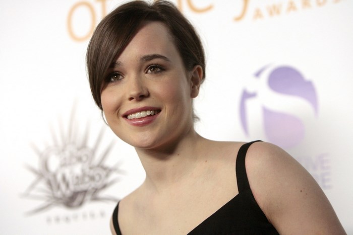 Smiling Ellen Page in Black Dress at Event