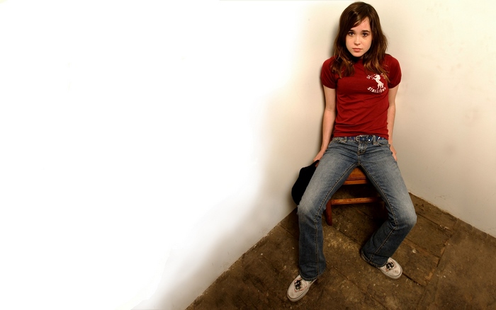 Ellen Page sitting in a corner