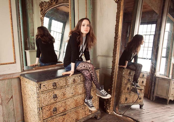 Ellen Page sitting on a dresser