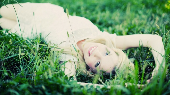 Woman lying in grass
