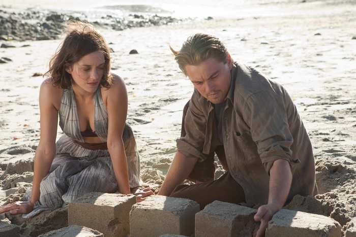 Marion Cotillard and Leonardo DiCaprio on a beach